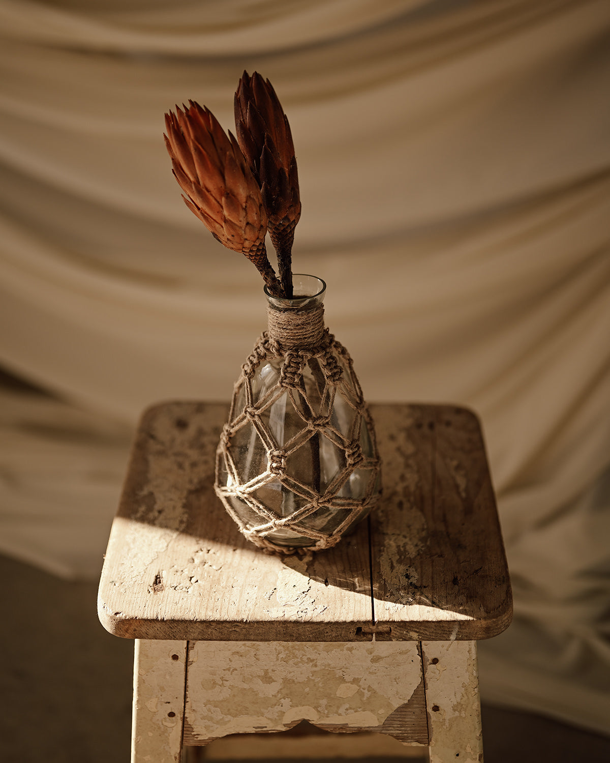 Rope and glass vase