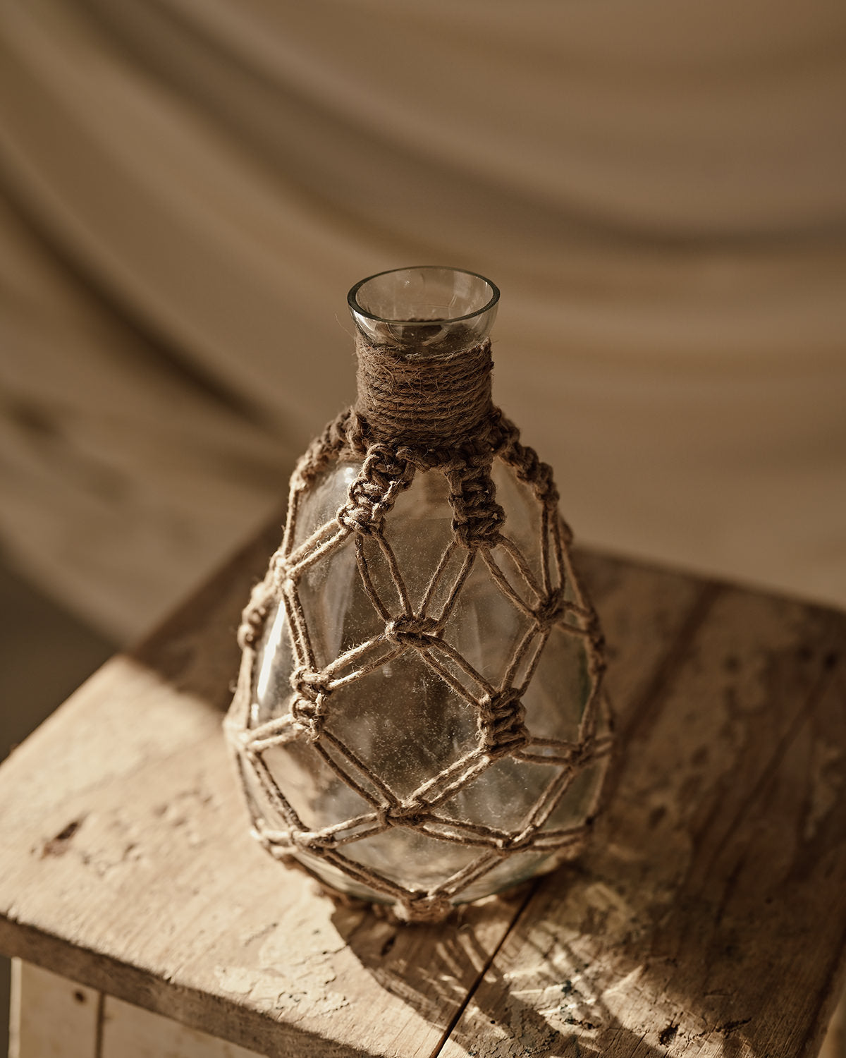 Rope and glass vase